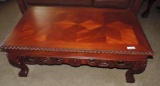Ornate carved wood coffee table with matching end table.