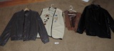 2 leather jackets, 1 leather vest and vest with pins.