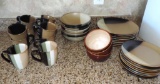 34 pieces of Sango Gold dust black dishes.