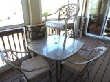 Glass top patio table with 4 chairs.