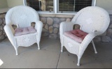 Pair of hampton bay white plastic wicker chairs.