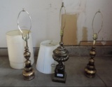 3 brass lamps with shades.
