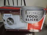 Compact electric food slicer with box.