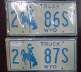 Two pair sequential 1975 Wyoming Truck License Plates.