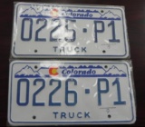 Two pair sequential Colorado Truck License Plates.