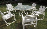 Glass top patio table with 6 chairs.