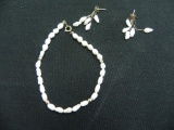14 Kt. Yellow gold fresh water bracelet and earrings.