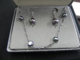 Freshwater pearl and silver earring and pendant set.