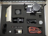 Minolta SRT MC II 35mm camera with flash, 3 lenses, case and accessories.