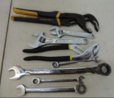 2 pair of pliers, 2 adjustable wrenches and 4 gear wrench's.