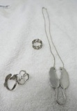 Silver cat necklace and 3 silver rings.