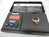 Size 7 marked 14k gold and amethyst ring. 5.1 grams with stone.