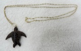 Small 14K gold chain with carved stone turtle.