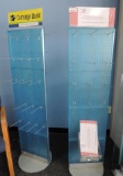 2 Rotateing display racks with pegboard hooks.