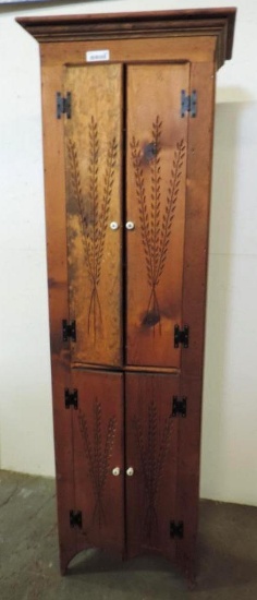 21x12x77" carved pine cabinet.