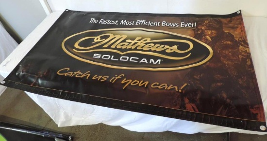 3 Mathews Solocam man cave bowhunting advertising signs.