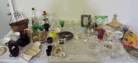 Table top full of antique collectibles.