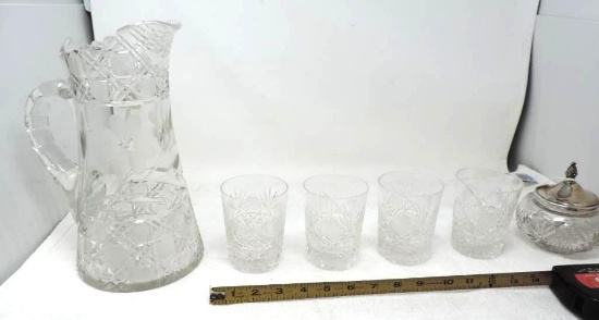 11" etched glass pitcher with 4 low ball glasses and silver top dresser jar.