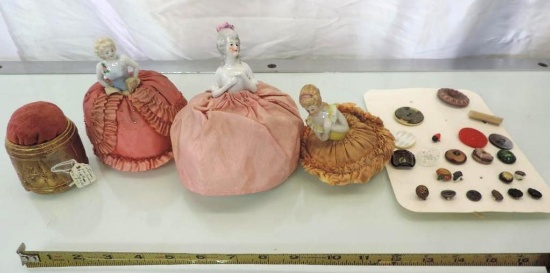 4 Early pin cushions and vintage button display.