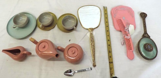 Ornate vintage hand mirrors and Russell Wright plastic child's dishes.