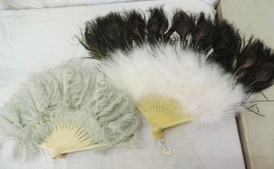 2 vintage feathered fans.
