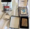 Two Zippo lighters and a relic pocket watch.