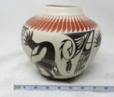 A & V Lucario signed pottery piece.