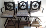 Three southwestern metal bar stools.