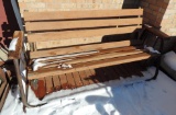 Metal and wood patio glider.