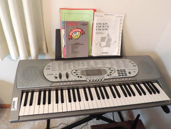 Casio CTK-574 keyboard with stand and manual (tested operable).