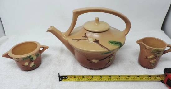 Three piece set of Roseville pottery.