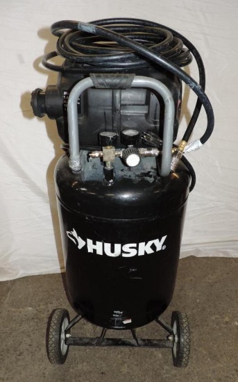 Husky 1.5HP 20 gallon air compressor with hose and chuck.