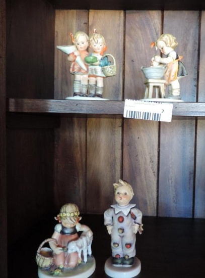 Four Hummel figurines.