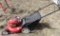 Lawn mower with Briggs & Stratton motor.