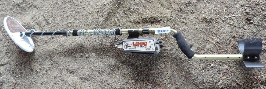 Tesoro Lobo Super Traq metal detector with manual.