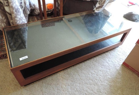 60x24x15" glass top coffee table.