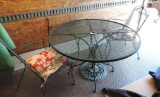 Green metal patio table with 2 chairs.