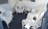 White plastic wicker patio set.