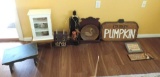 Wooden stools, display cabinet and signs.