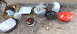 Red innova cast iron pan and kitchen goodies assortment.