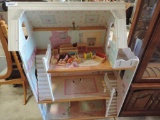 Doll house and child's bench furniture grouping.