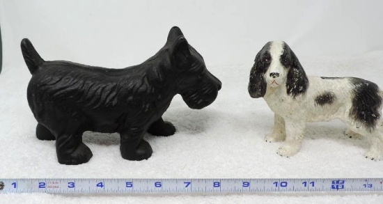 Cast iron Scotty and Spaniel dog statues.
