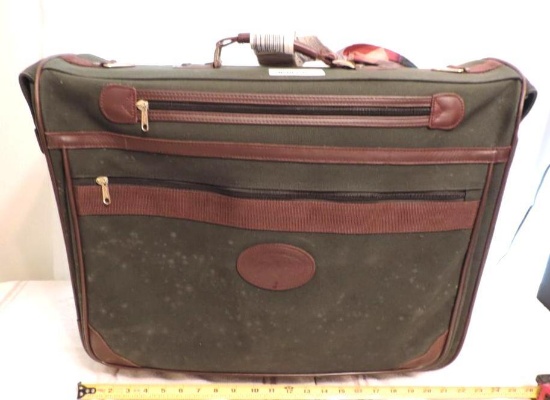 Orvis suitcase. This orvis gentleman's bag has spotting on one side but would possibly clean up.