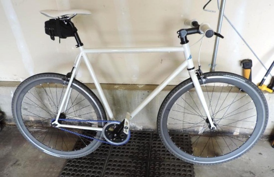 white unmarked road bike with 60cm frame.