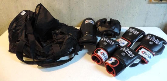 Under Armor duffle bag with boxing gear.