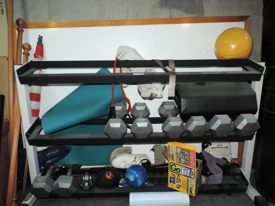 York bar bell rack with weights and accessories.
