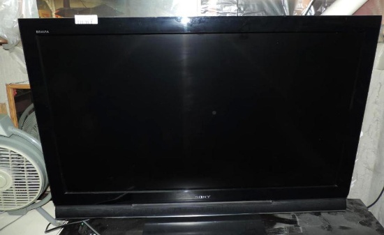 Sony 46" LCD TV with remote and stand.