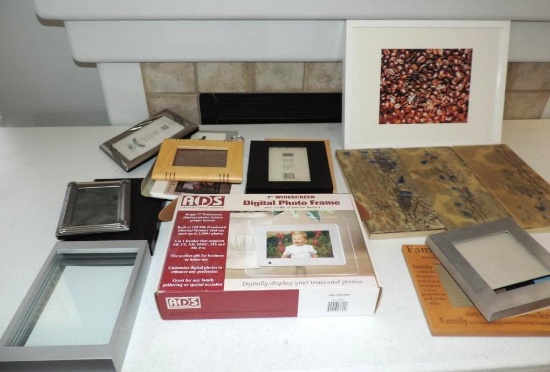 Assortment of art and picture frames.