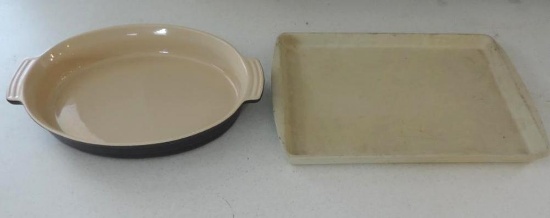 LeCruset 0403 stoneware platter and pampered chef stone cookie sheet.