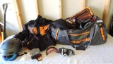 Patagonia duffle bag loaded with men's snow boarding gear.